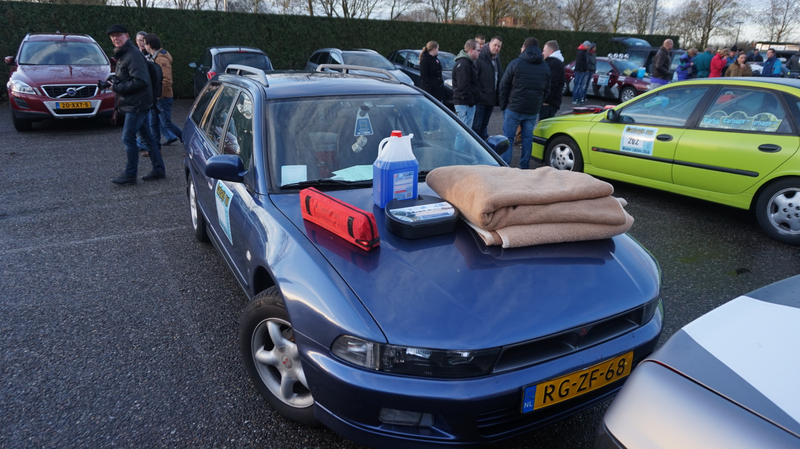 Our Galant, with some of the required safety items on the hood, ready for inspection. Note the horrific fuzzy dice. 9:33